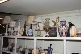 Collection of table lamps, vases, oil lamps, horse head statue, penguin ornament.