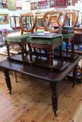 Late Victorian oak extending dining table, two leaves and winder raised on reeded legs,