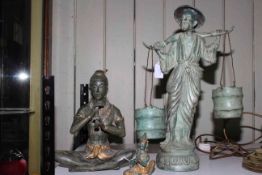 Three Oriental bronzed effect figures.