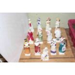 Thirteen Royal Doulton Kate Greenaway figures.