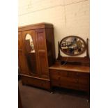 Edwardian inlaid mahogany oval mirror door wardrobe and dressing table.