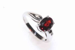 Single stone garnet and diamond 9 carat white gold ring, size K.