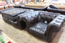 Brown deep buttoned leather two section Chesterfield settee, chair and large footstool.