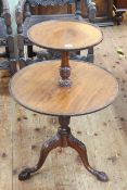 Mahogany two tier graduated circular dumb waiter on pedestal tripod base, 81cm high.