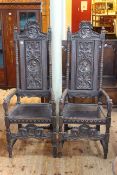 Pair high carved panel back open armchairs.