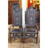 Pair high carved panel back open armchairs.