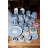 Collection of Wedgwood Blue Jasperware including teapot, biscuit barrel, jugs, plates, etc.