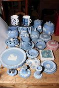 Collection of Wedgwood Blue Jasperware including teapot, biscuit barrel, jugs, plates, etc.