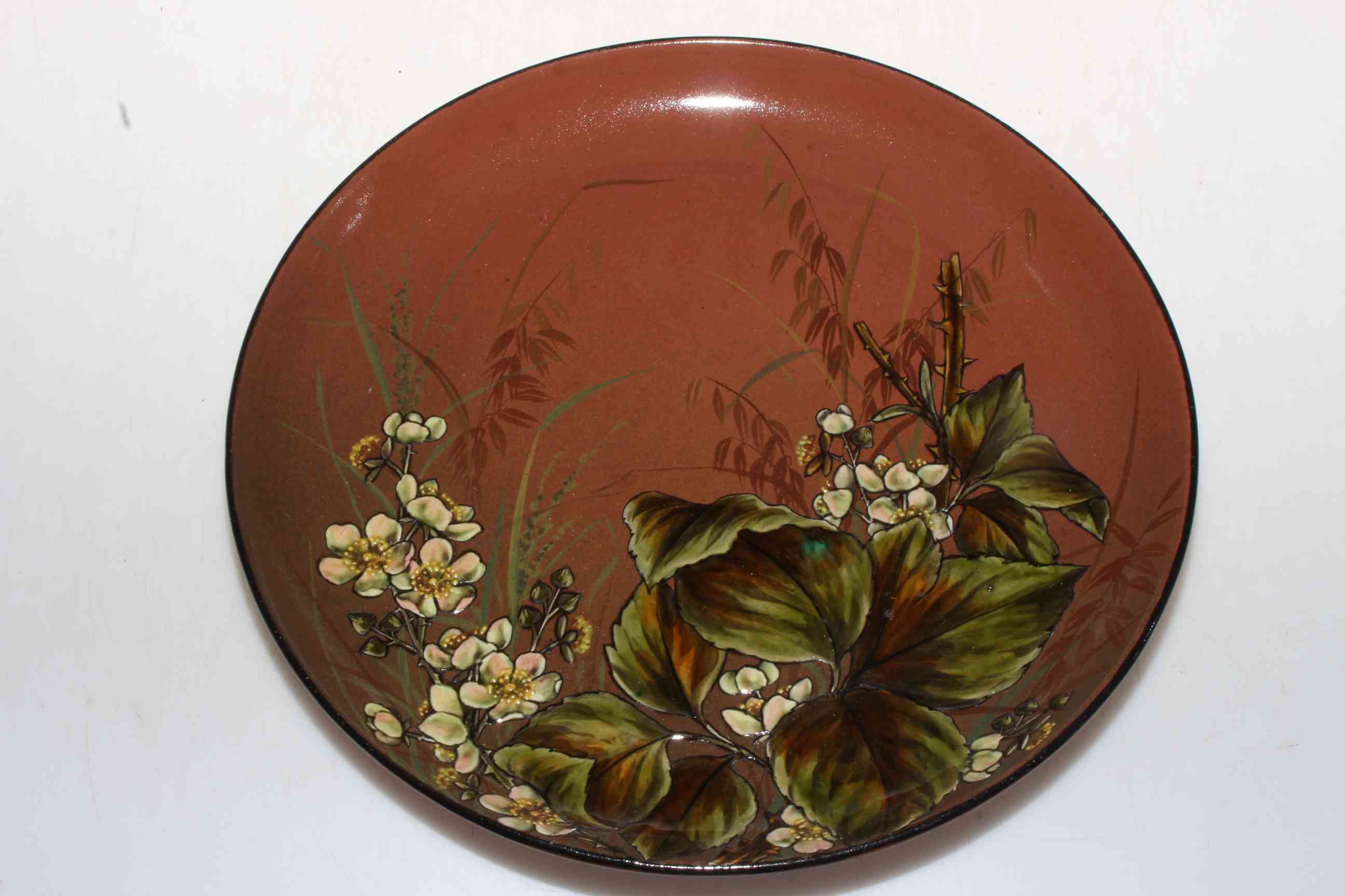 Linthorpe pottery plate with blossom decoration, no. 299.