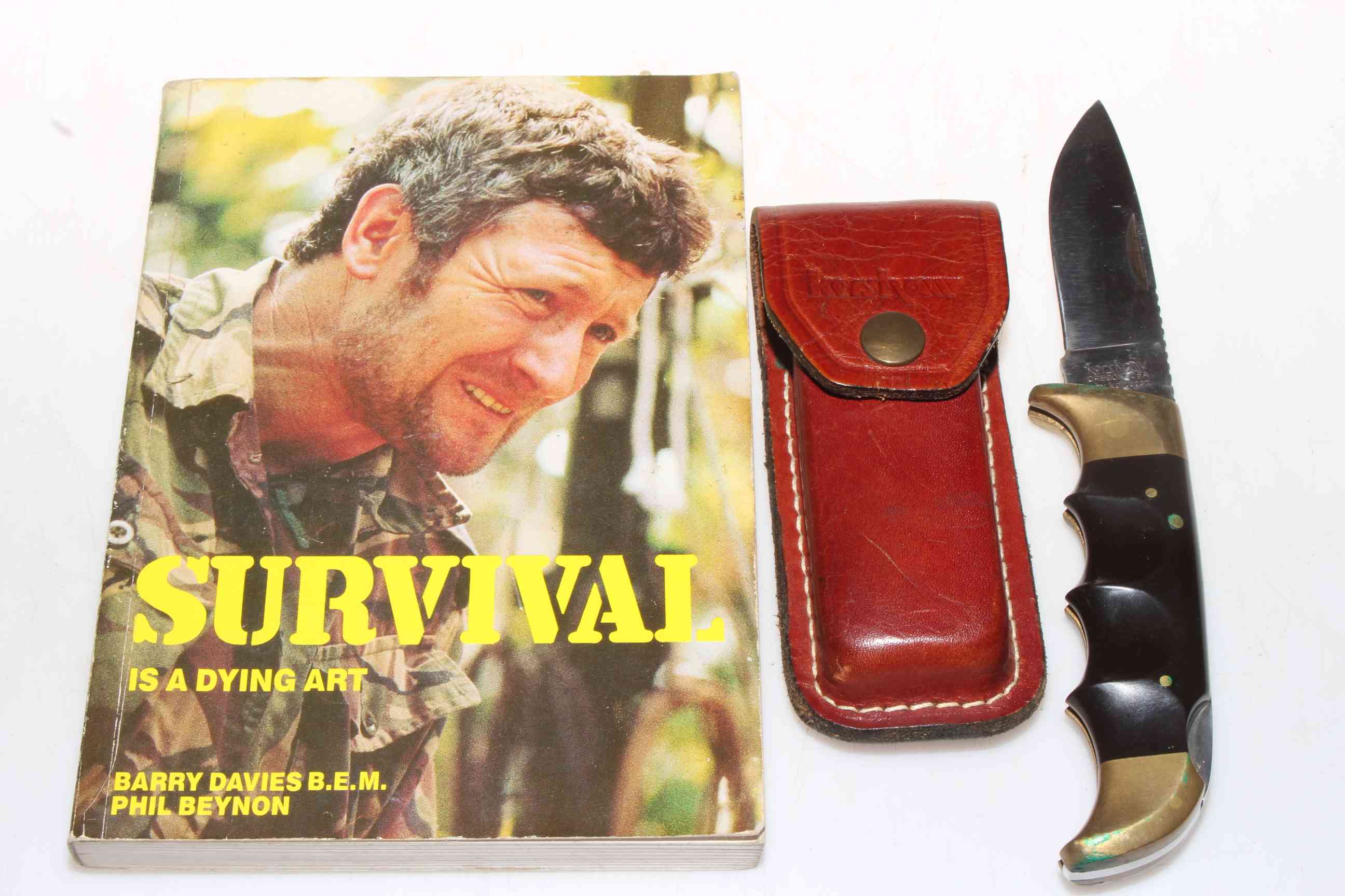 Kershaw USA 1050 professional locking knife and survival book.