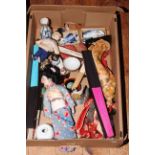 Box of Oriental dolls, fans, pottery fish.