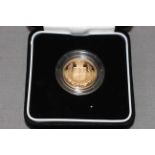 The 2002 United Kingdom gold proof sovereign by The Royal Mint in box with COA No. 09132.