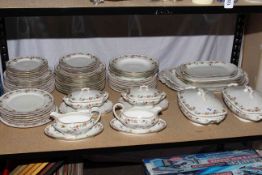 Limoges dinner service comprising approximately sixty pieces including tureens, gravy boats,