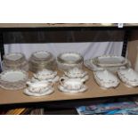 Limoges dinner service comprising approximately sixty pieces including tureens, gravy boats,