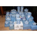 Collection of boxed Wedgwood Blue Jasperware including lidded trinket boxes, lidded jars, vases,