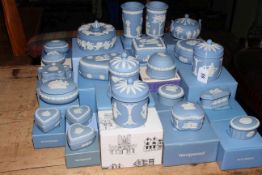 Collection of boxed Wedgwood Blue Jasperware including lidded trinket boxes, lidded jars, vases,