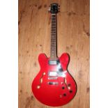 Red Johnny Brook electric guitar with Emax bag.