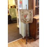 Victorian mahogany and brass tripod pole screen having adjustable embroidered banner, 151cm high.