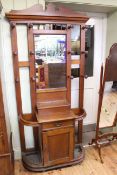 Early 20th Century oak mirror back hallstand, 207cm high by 102cm wide by 36cm deep.