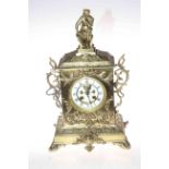 Highly decorative brass mantel clock with a knight as the top centre piece, 40cm high.