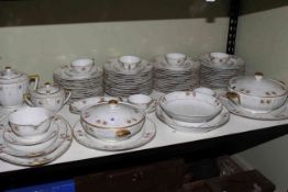 Limoges seventy piece dinner service with two covered tureens and serving dishes.