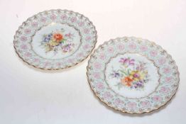 Pair Dresden flower decorated and pierced border plates, 22cm diameter.