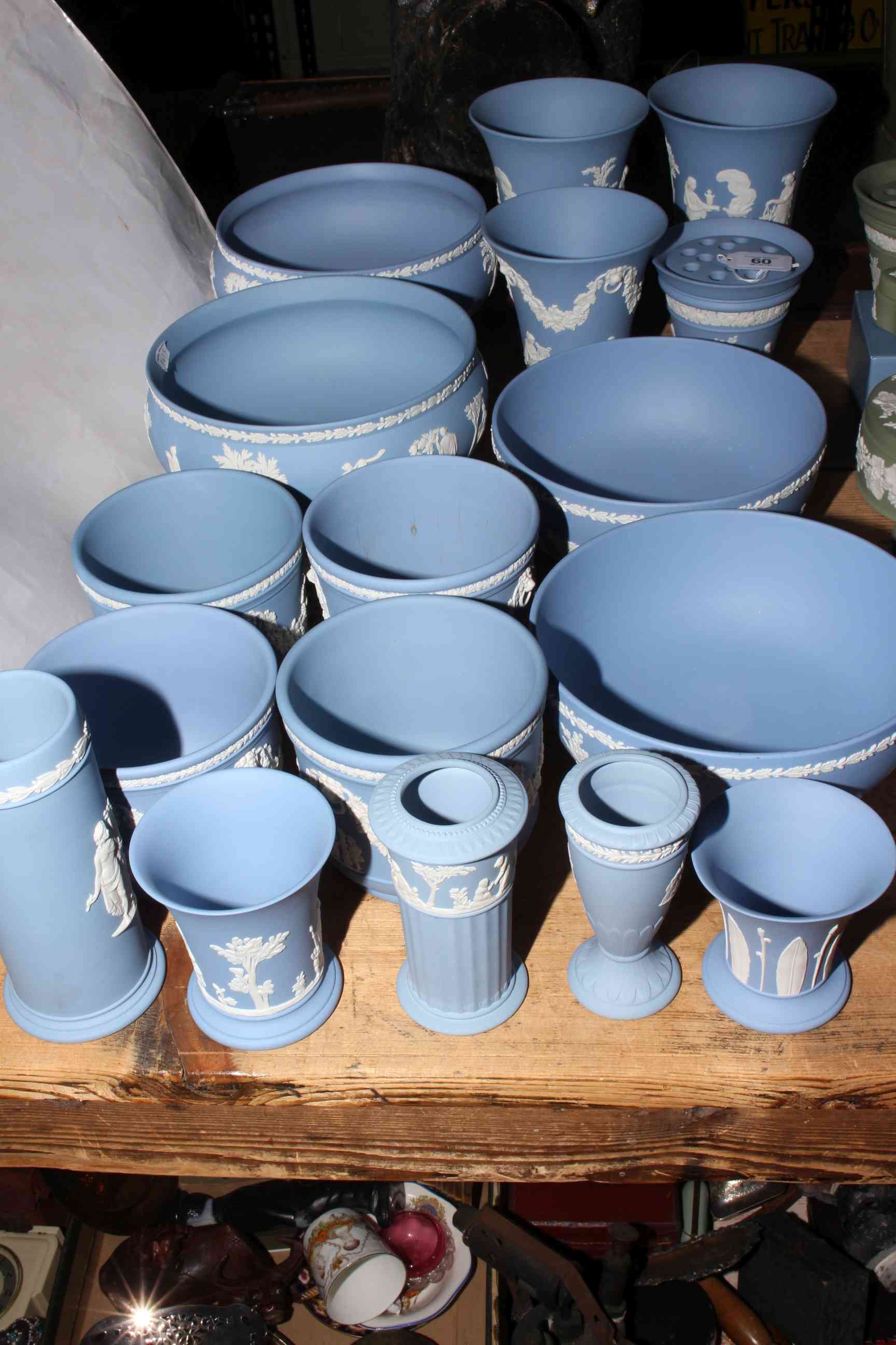 Collection of Wedgwood Blue Jasperware including four bowls, four planters and various vases.