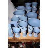 Collection of Wedgwood Blue Jasperware including four bowls, four planters and various vases.