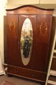 Early 20th Century inlaid mahogany oval mirror door wardrobe.