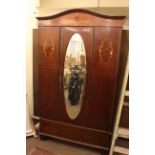 Early 20th Century inlaid mahogany oval mirror door wardrobe.