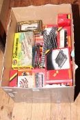 Collection of model railway accessories including rolling stock, track, level crossing,