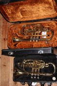 Two cased cornets including Boosey & Hawkes York International.