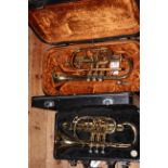 Two cased cornets including Boosey & Hawkes York International.