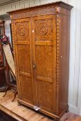 Early 20th Century carved oak double door wardrobe, 202cm high by 113cm wide by 47cm deep.