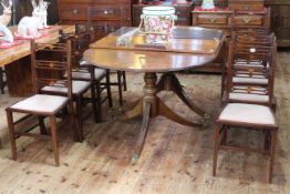 Oval mahogany twin pedestal extending dining table and two leaves,