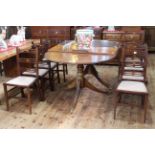 Oval mahogany twin pedestal extending dining table and two leaves,