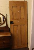 Stripped pine panelled door, 201cm by 71cm.