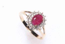 9 carat gold, ruby and diamond cluster ring, size P.