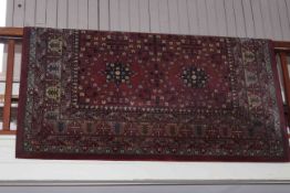 Belgian carpet with a burgundy ground, 2.90 by 2.00.