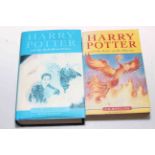 Two Harry Potter books, First Edition Half Blood Prince with dust cover and another.