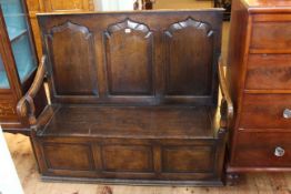 Oak triple arched fielded panel back box settle bearing label for Thomas Clarkson & Sons,