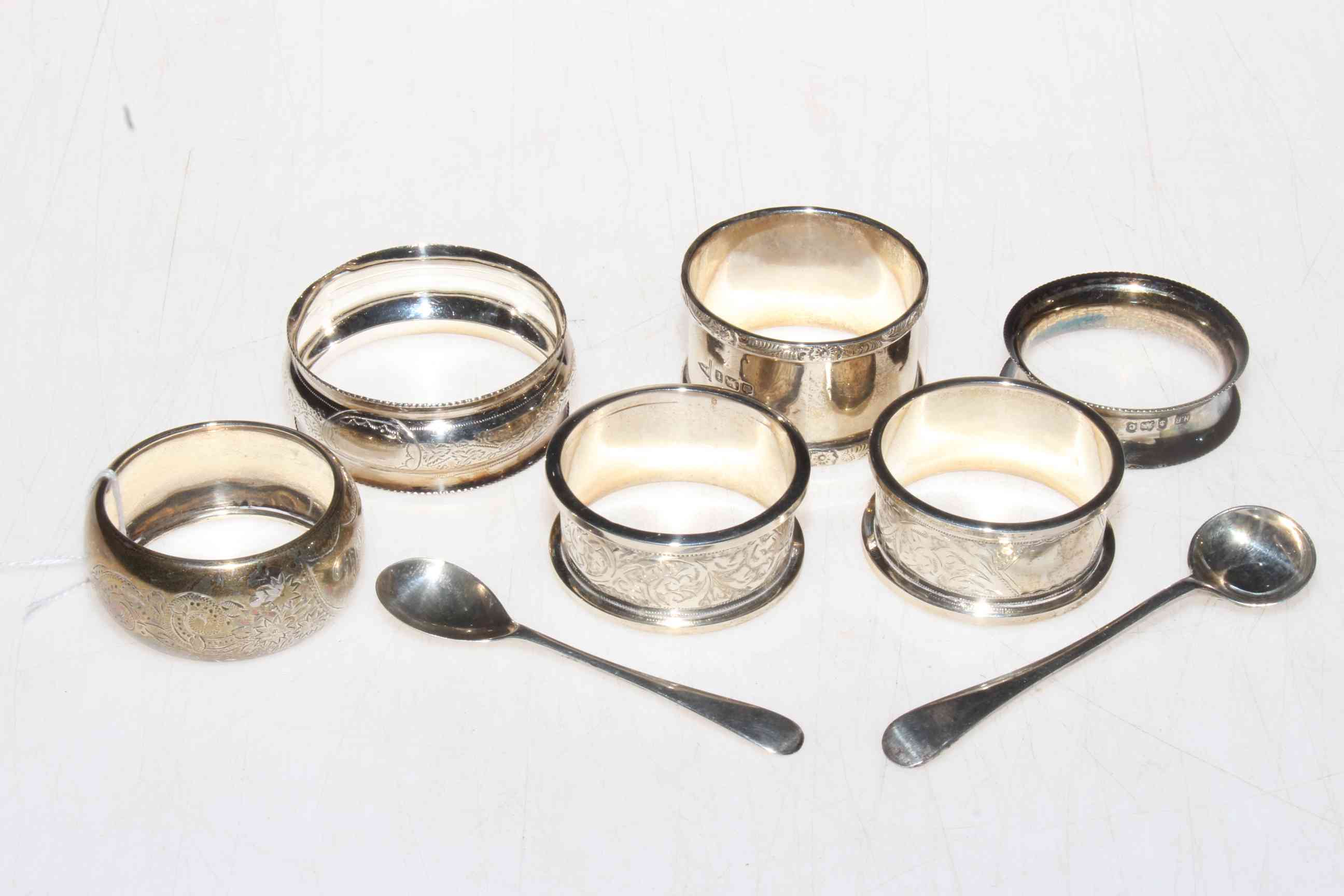 Framed silver model of a junk, together with six silver napkin rings and two salt spoons.
