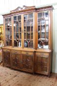 Impressive Victorian aesthetic breakfront library bookcase having swan neck pediment above four