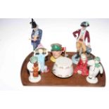 Two Royal Doulton Snowman figures, four Royal Doulton figures, The Wizard, Officer of the Line,