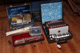 Cased flute, cased clarinet, cased trumpet, Russian piano accordion, Irish whistle,