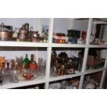 Full shelf of assorted glass, metalwares, kitchen scales and weights, mantel clock, linen,