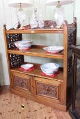 Victorian mahogany buffet having three open shelves with fretwork panelled sides above two carved