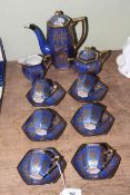 Fifteen piece Japanese blue and gilt decorated coffee service.