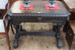 Victorian carved oak single drawer side table with lion mask canted corners raised on four turned