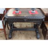 Victorian carved oak single drawer side table with lion mask canted corners raised on four turned